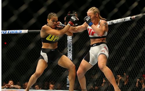 Valentina Shevchenko (R) punches Amanda Nunes during UFC 196 at the MGM Grand Garden Arena on March 5, 2016