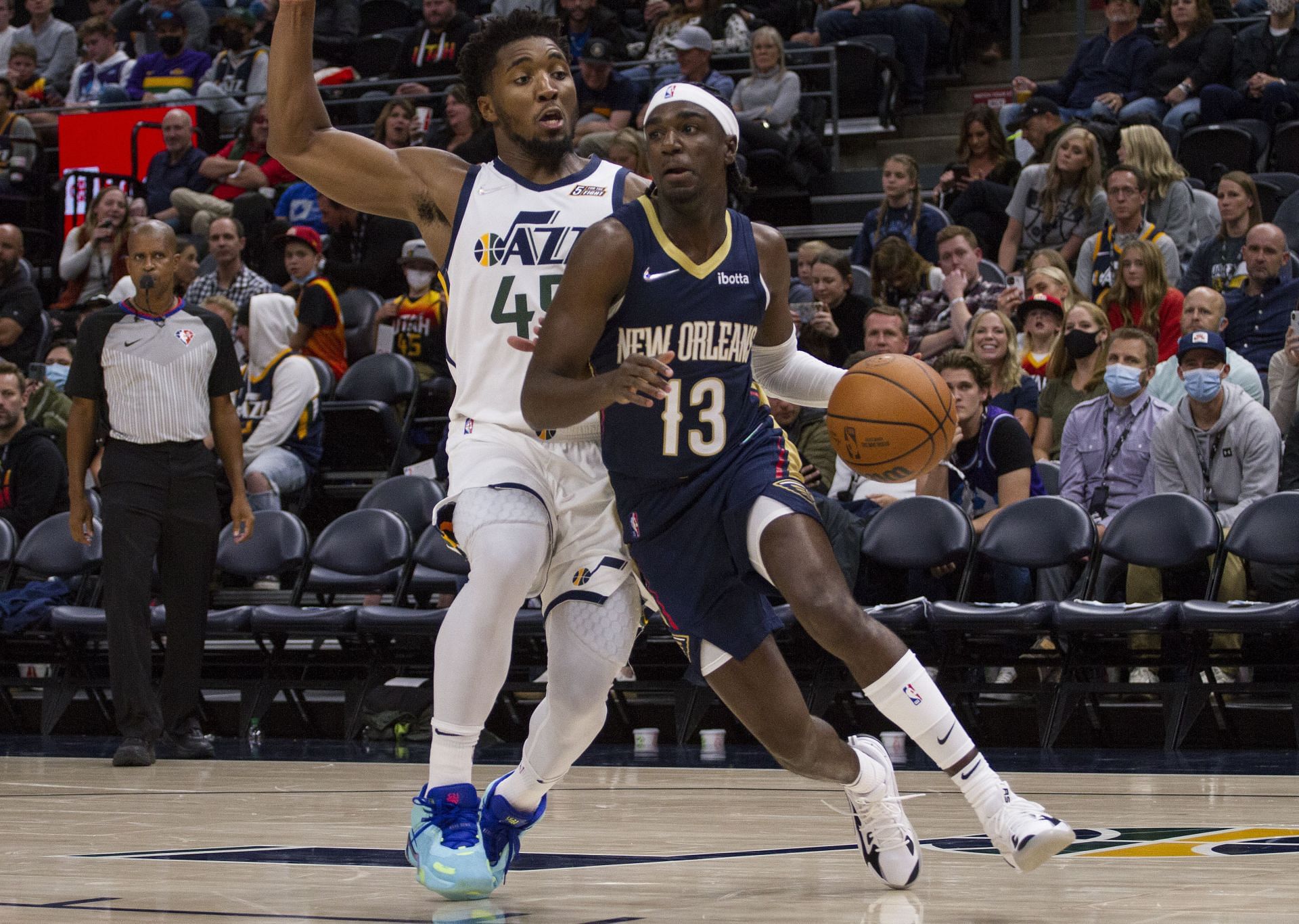 Kira Lewis Jr. of the New Orleans Pelicans drives against Donovan Mitchell of the Utah Jazz.