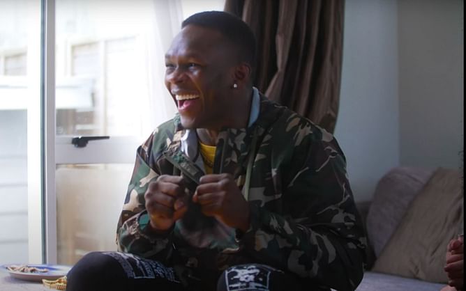 Watch: Israel Adesanya goes absolutely berserk while watching the UFC 268 slugfest between Justin Gaethje and Michael Chandler