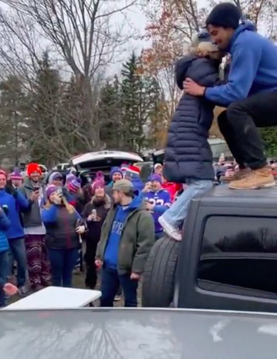 Watch: Bills fan almost breaks her neck following botched table-smash  attempt