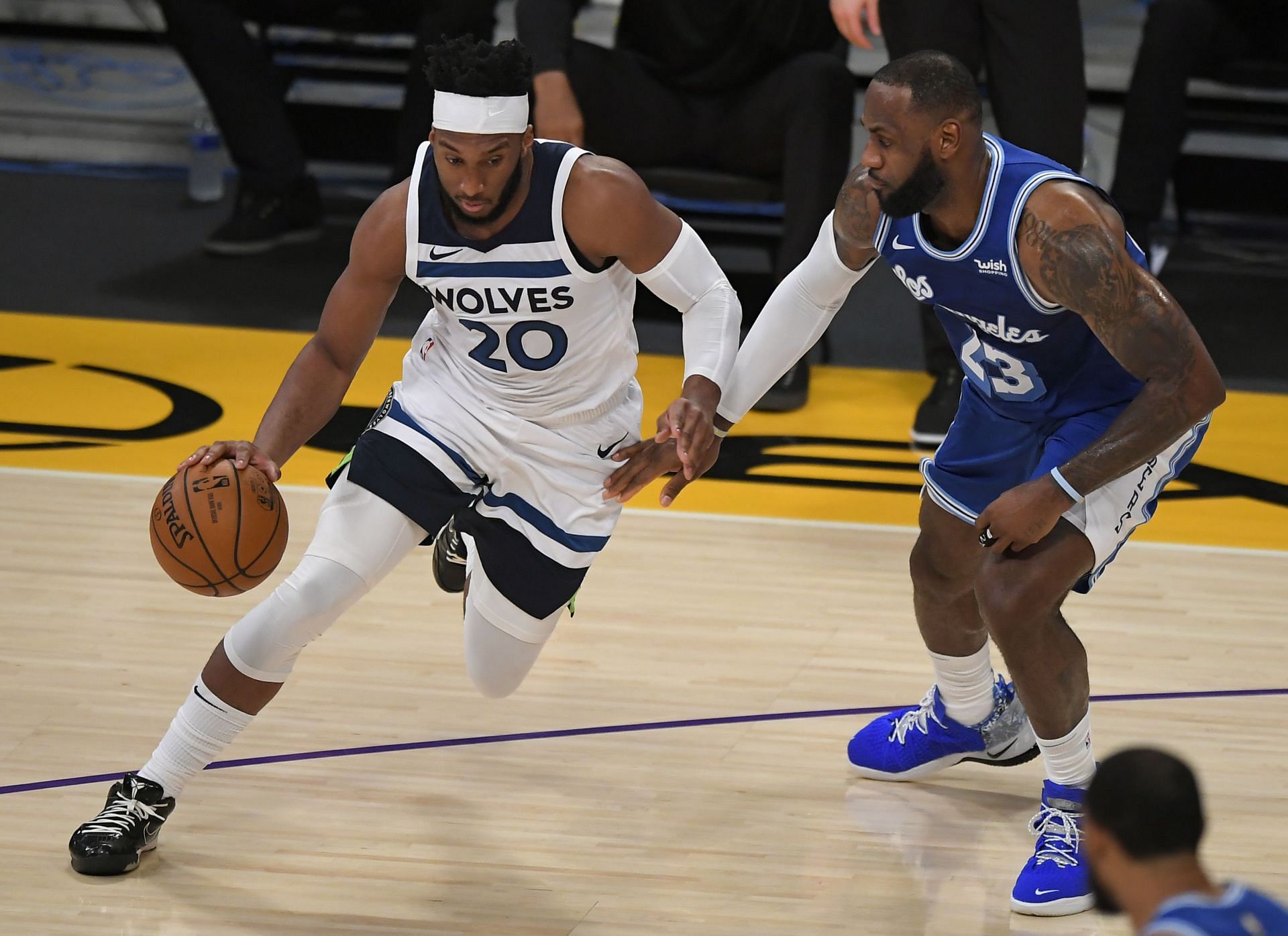 Josh Okogie of the Minnesota Timberwolves and LeBron James of the Los Angeles Lakers.