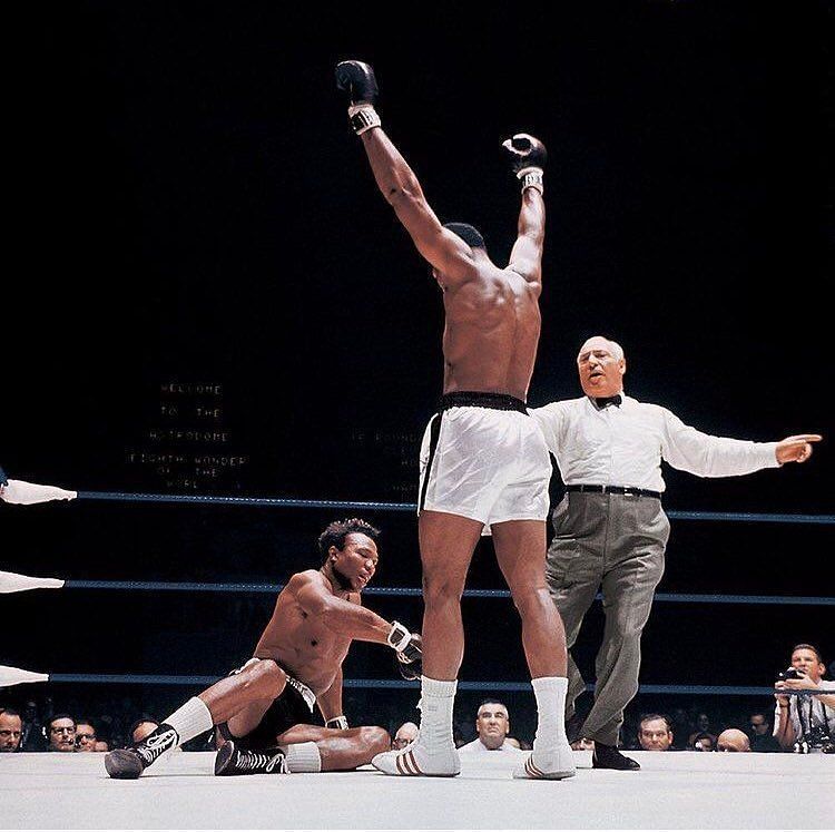 Muhammad Ali raising his arms in victory [Image Credits- @muhammadali on Instagram]