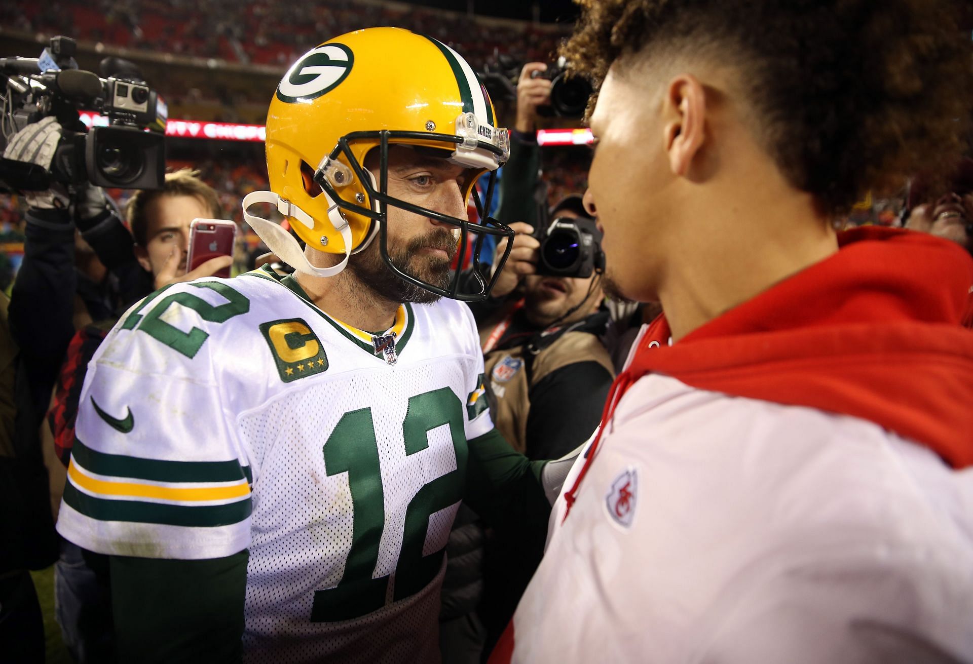 Aaron Rodgers (12) and Patrick Mahomes meet at midfield following the Packers and Chiefs&#039; matchup last season (Photo: Getty)