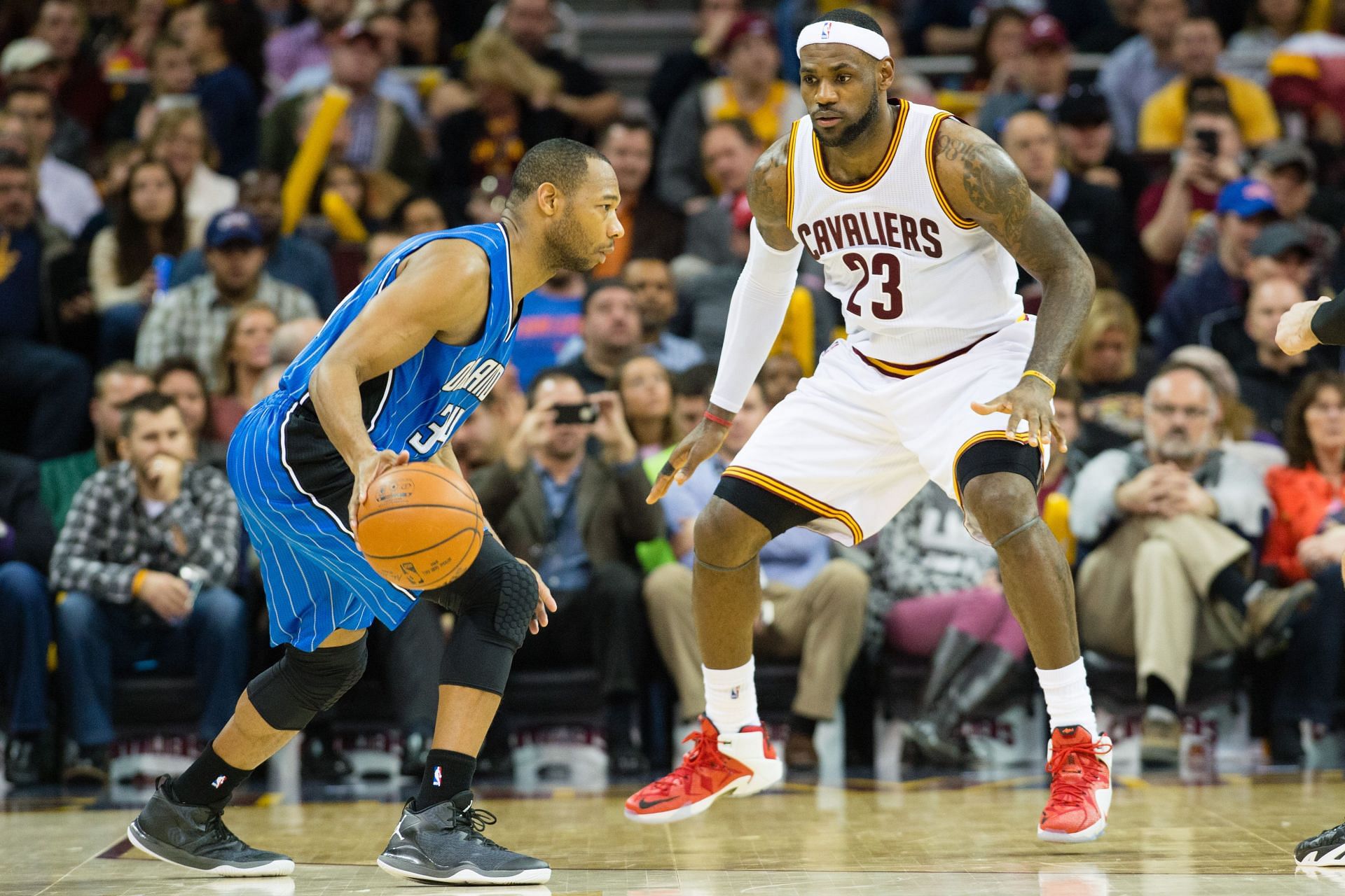 LeBron James defends Willie Green of the Orlando Magic.