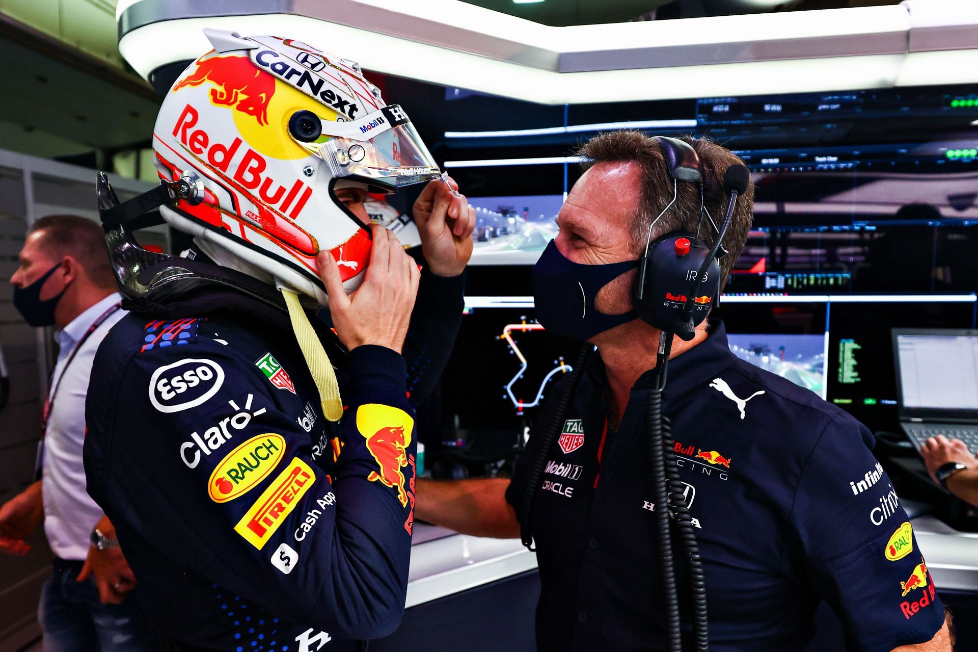 F1 Grand Prix of Qatar - Christian Horner checks on Max Verstappen during qualifying.