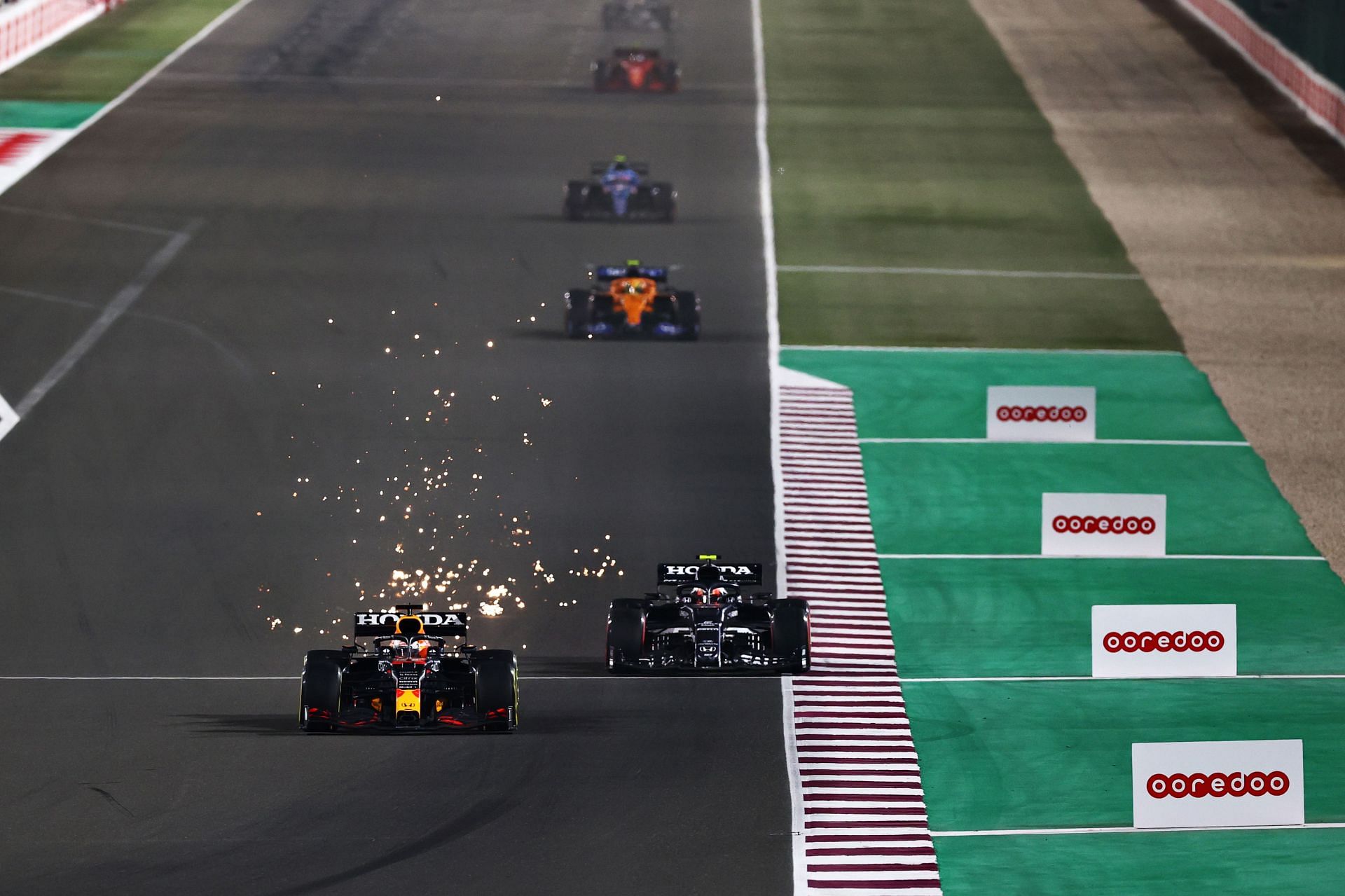 Max Verstappen passing Pierre Gasly in the race at the Losail Internatioal circuit in Qatar.