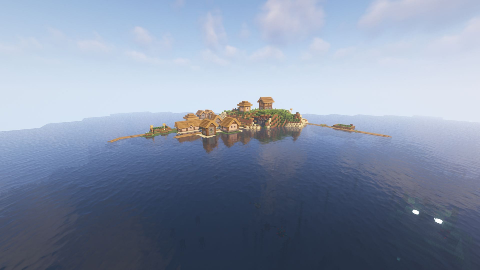 A village on an island next to an ocean monument (Image via Minecraft)