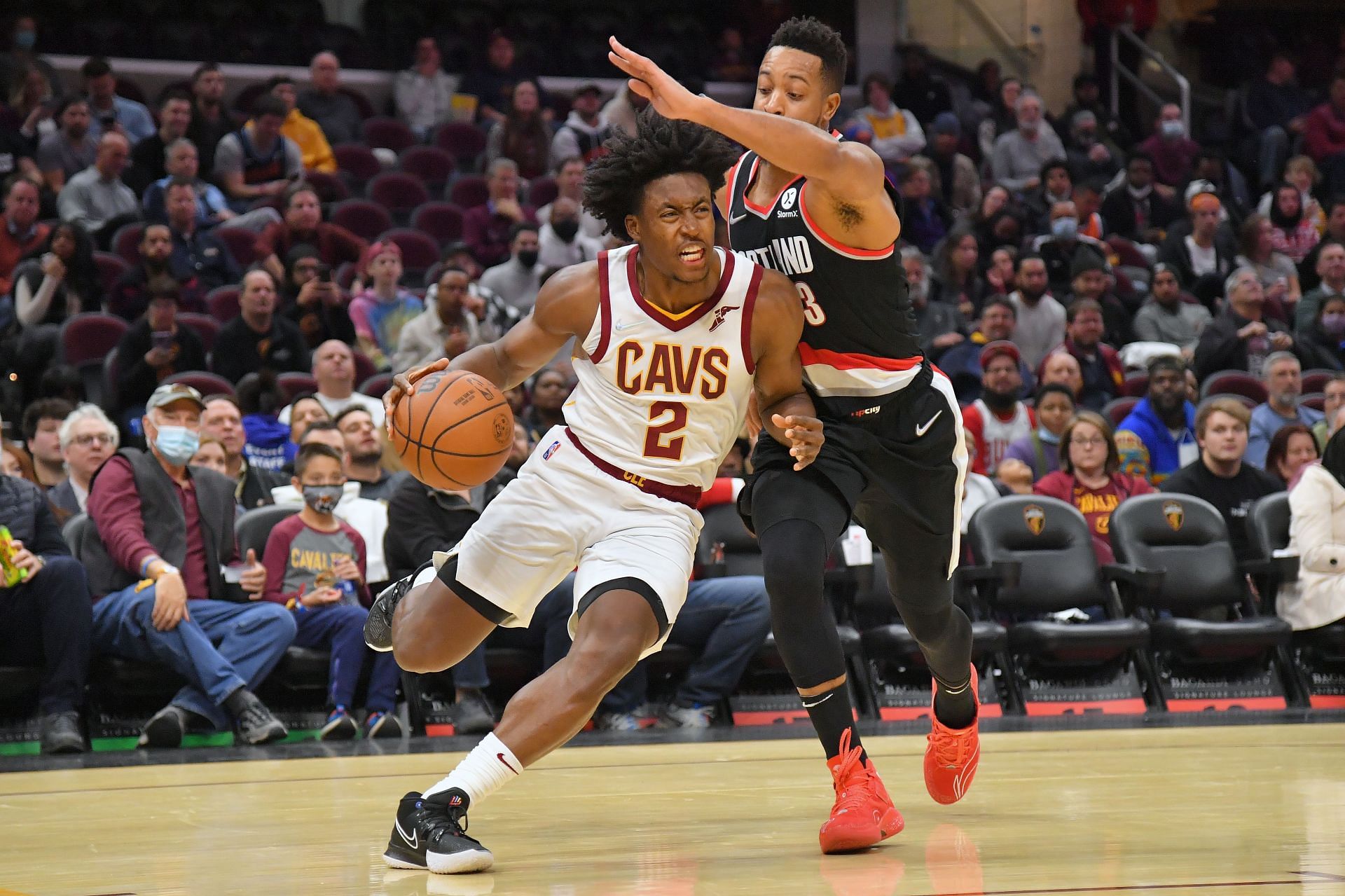 Collin Sexton of the Cleveland Cavaliers drives against CJ McCollum of the Portland Trail Blazers.