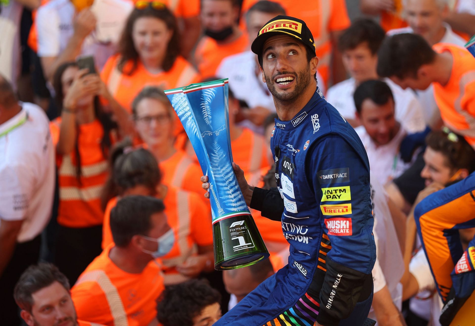 Daniel Ricciardo celebrates his win with his team at Monza in Italy