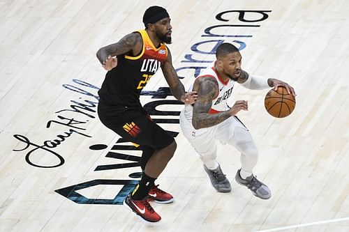 Damian Lillard of the Portland Trail Blazers drives against Utah Jazz's Mike Conley