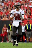 Buccaneers fan Byron Kennedy shows off all that he has gotten in return for handing over Tom Brady's 600th TD ball