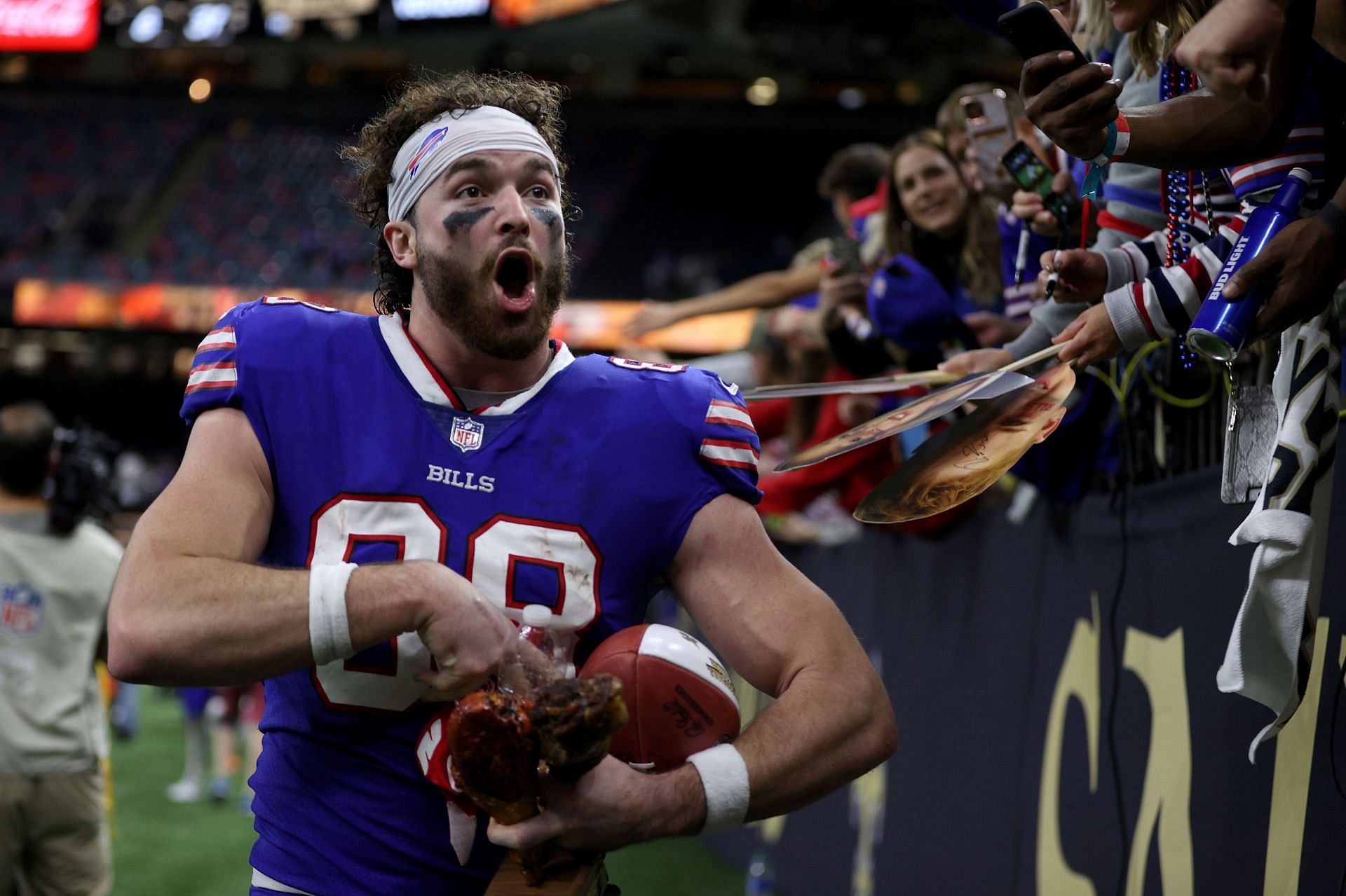Tight end Dawson Knox celebrates with turkey after the Bills&#039; Thursday victory over New Orleans
