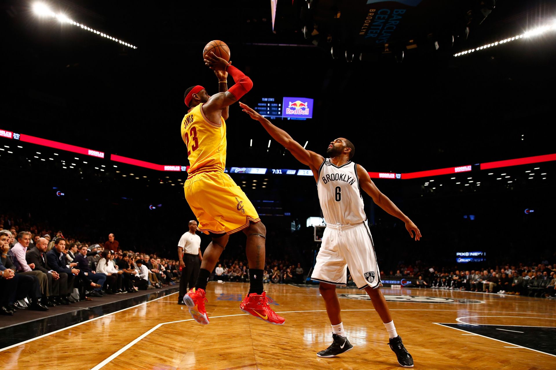 LeBron James #23 of the Cleveland Cavaliers shoots the ball against Alan Anderson #6 of the Brooklyn Nets