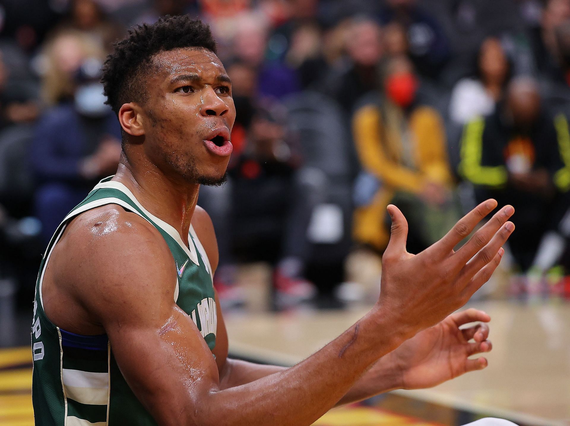 Giannis Antetokounmpo of the Milwaukee Bucks reacts as he is charged with an offensive foul against the Atlanta Hawks