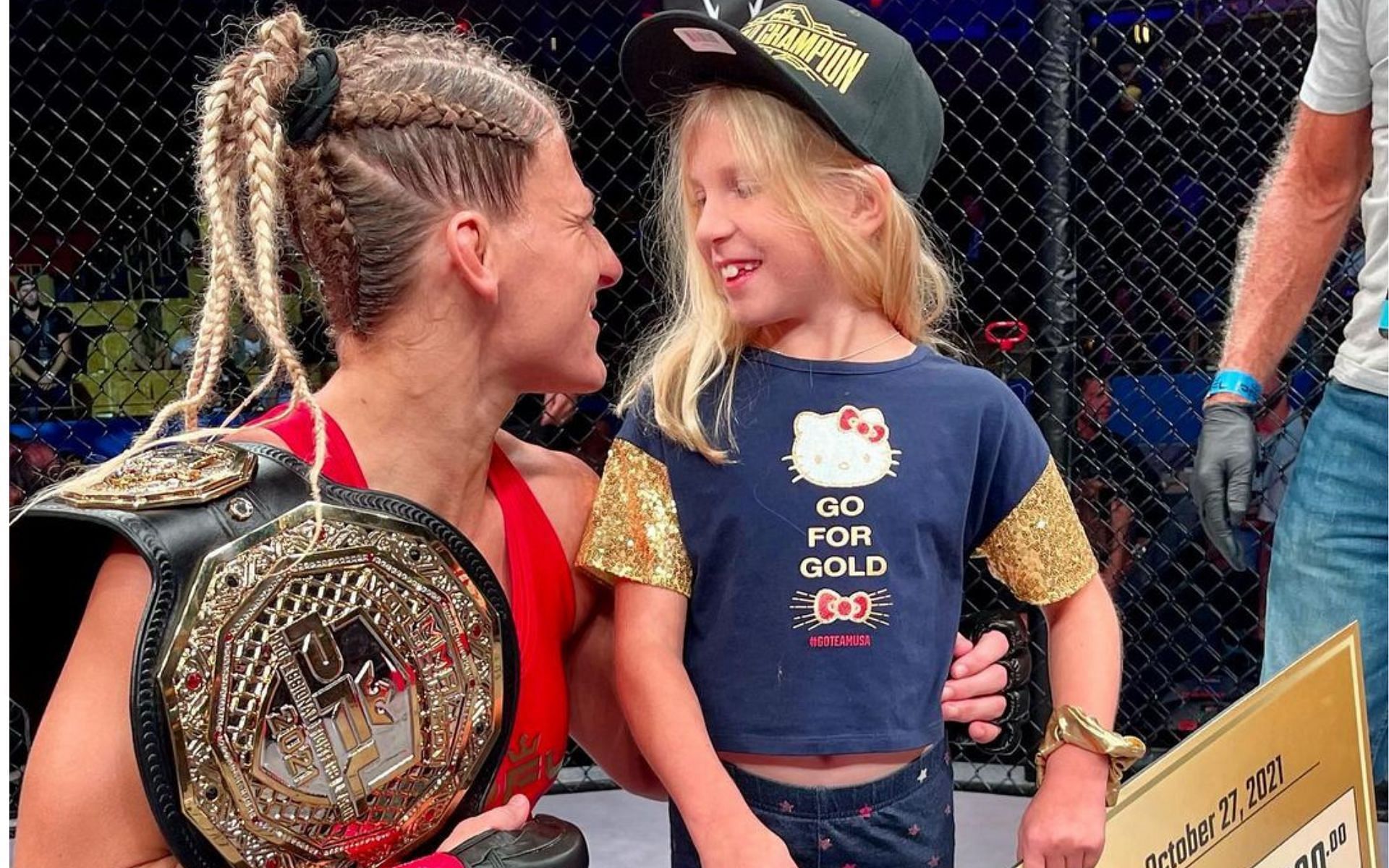 Kayla Harrison poses with her daughter after her recent win at the the PFL women&#039;s lightweight finals. Image courtesy: Instagram @ judokayla
