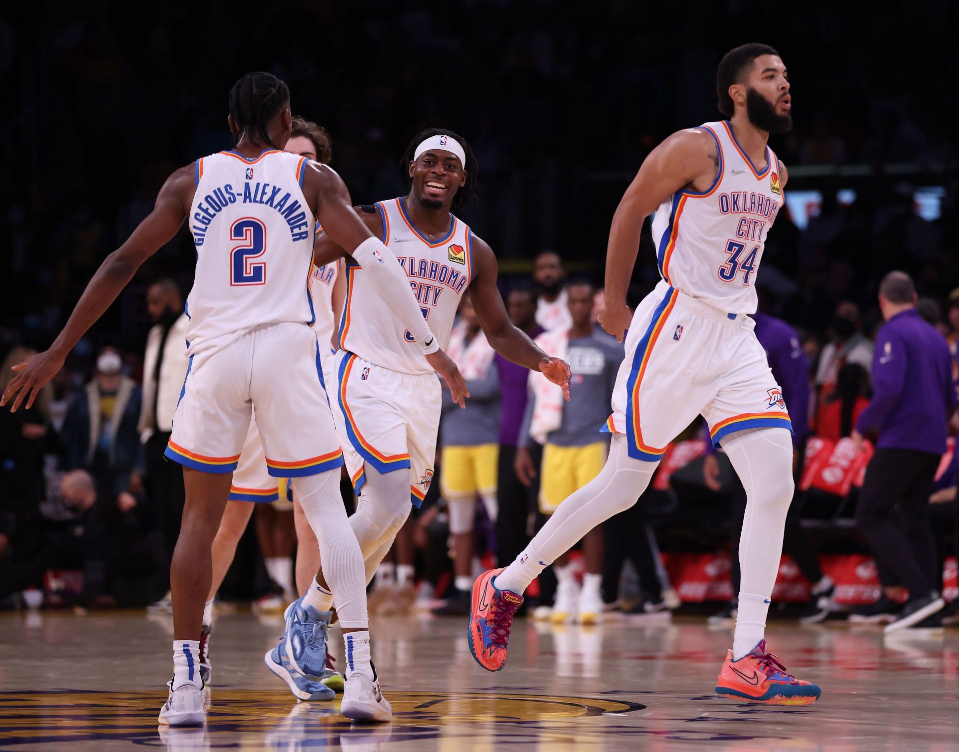 Oklahoma City Thunder celebrate after a shot against the LA Lakers.