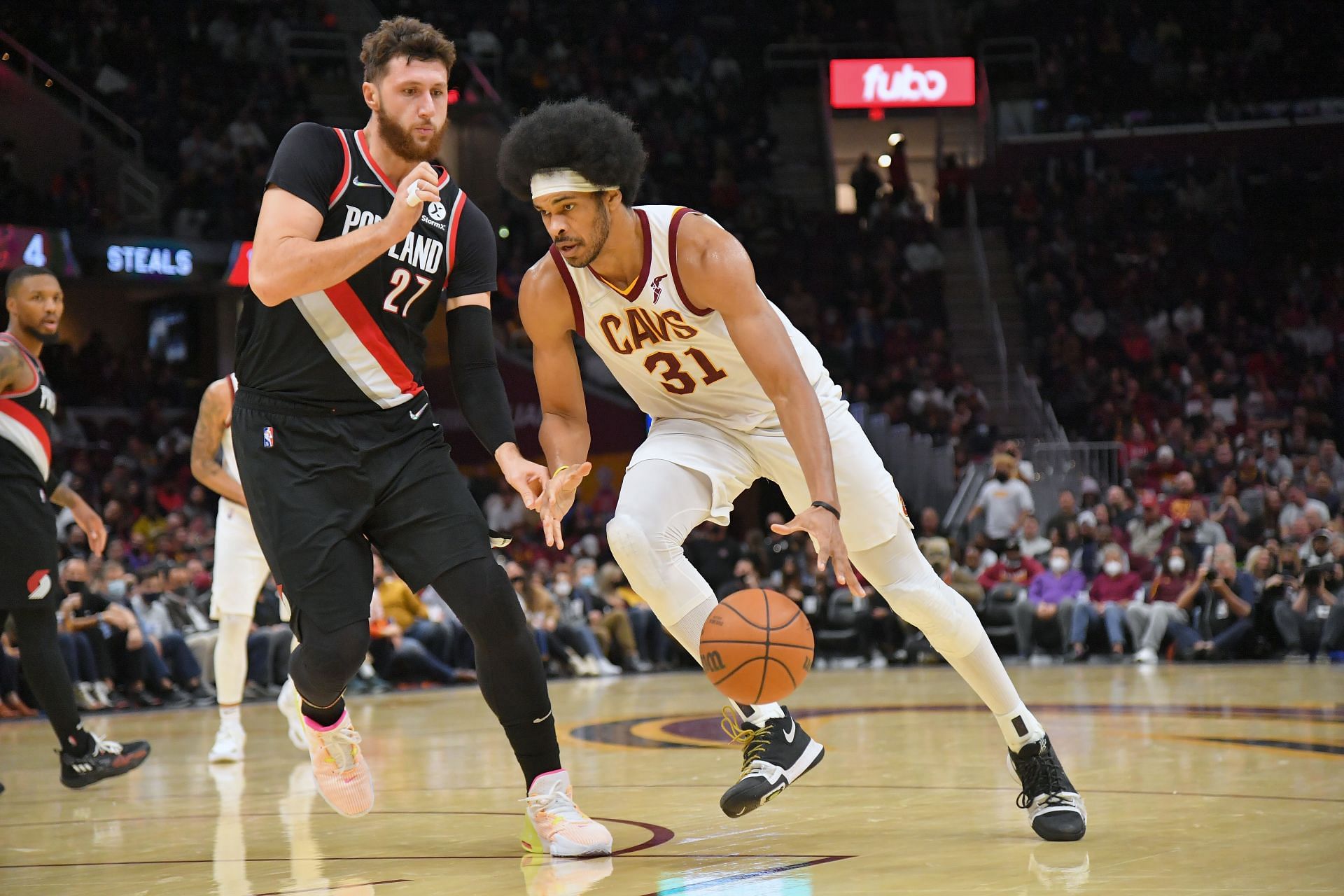 Jarrett Allen #31 of the Cleveland Cavaliers drives against Jusuf Nurkic of the Portland Trail Blazers