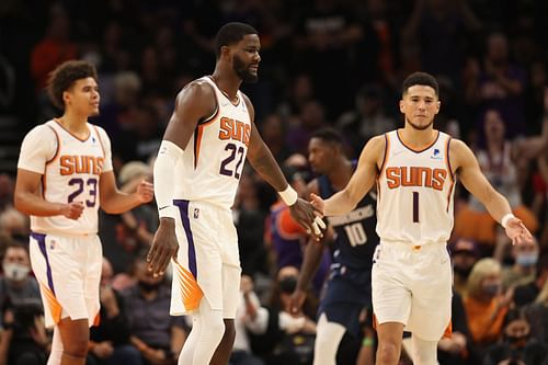 Deandre Ayton (22) of the Phoenix Suns celebrates with Devin Booker (1) after scoring against the Dallas Mavericks.