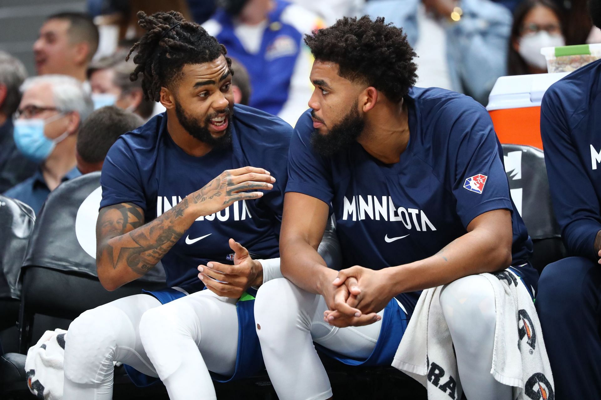 D&#039;Angelo Russell discusses the game with Minnesota Timberwolves teammate Karl-Anthony Towns