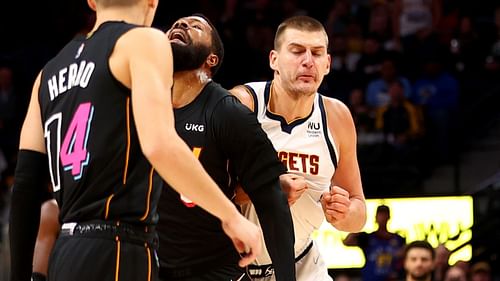 Nikola Jokic shoving Markieff Morris in the back [Source: NewsConcerns]