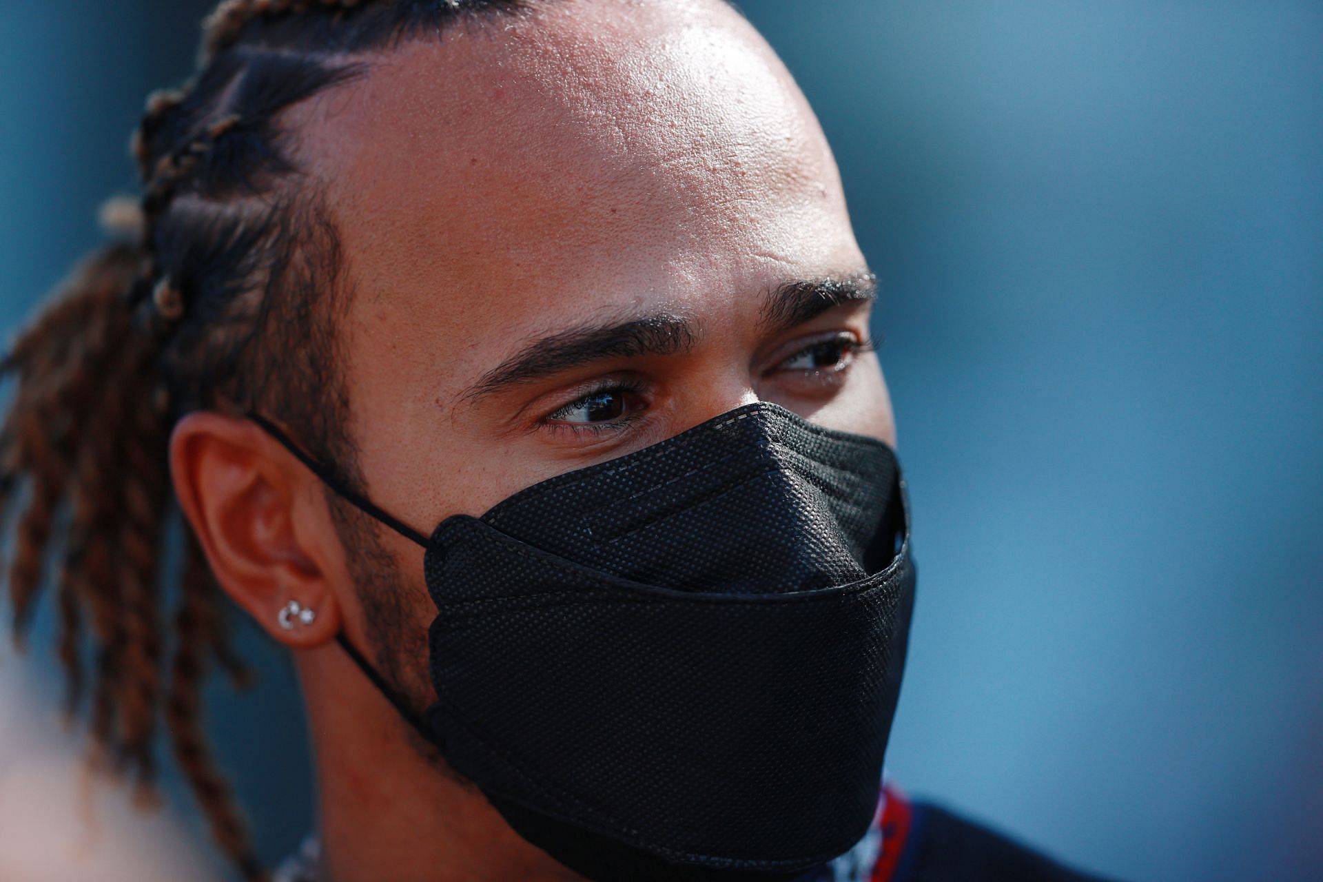 Lewis Hamilton in the F1 paddock. (Photo by Mark Thompson/Getty Images)