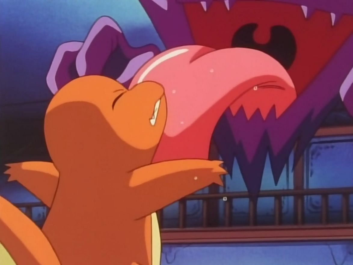 Haunter uses Lick on Ash&#039;s Charmander in the Pokemon anime (Image via The Pokemon Company)