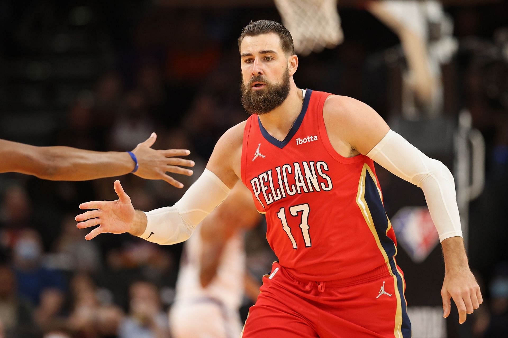 Jonas Valanciunas #17 of the New Orleans Pelicans high fives teammates after a three-point shot against the Phoenix Suns during the first half of the NBA game at Footprint Center on November 02, 2021 in Phoenix, Arizona.