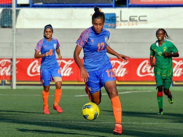 Indian women&#039;s football team star Manisha Kalyan (centre) in action from an older game.