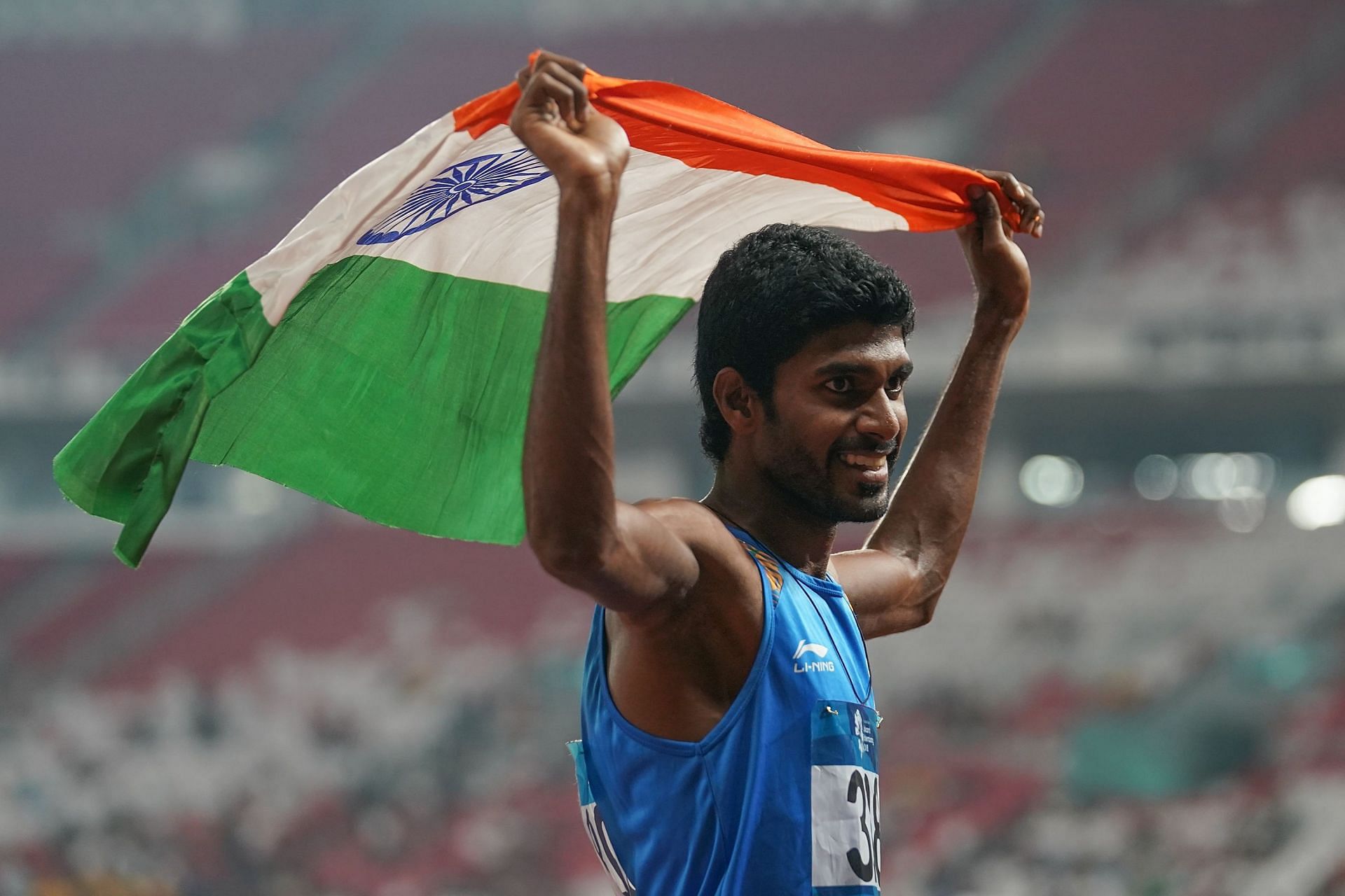 Jinson Johnson celebrates winning a medal at the 2018 Asian Games