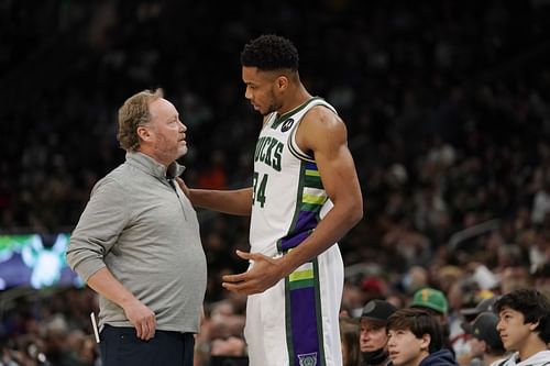 Giannis Antetokounmpo, right, of the Milwaukee Bucks talks with coach Mike Budenholzer