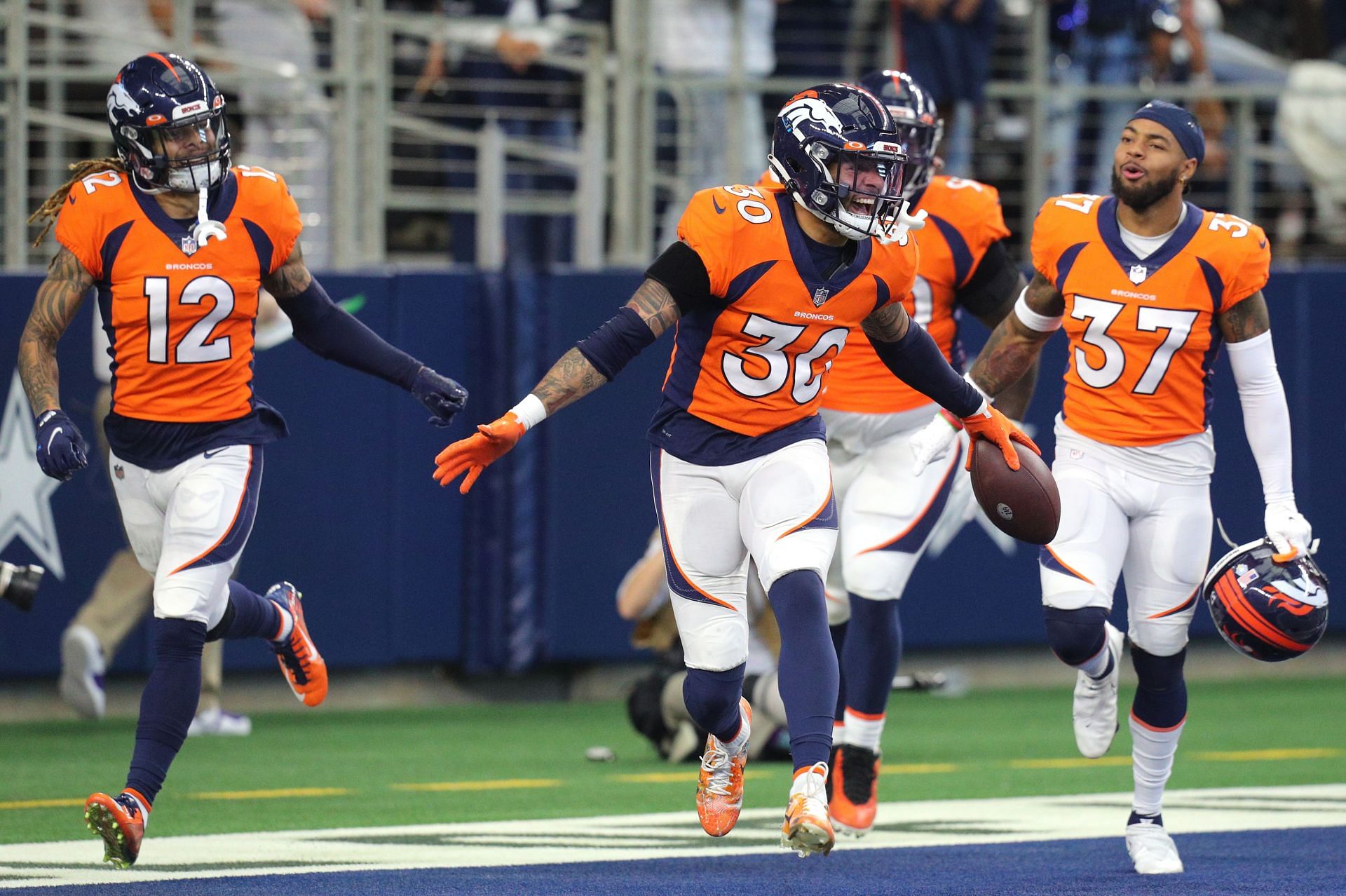 The Denver defense celebrates after a turnover during their Week 9 win over Dallas