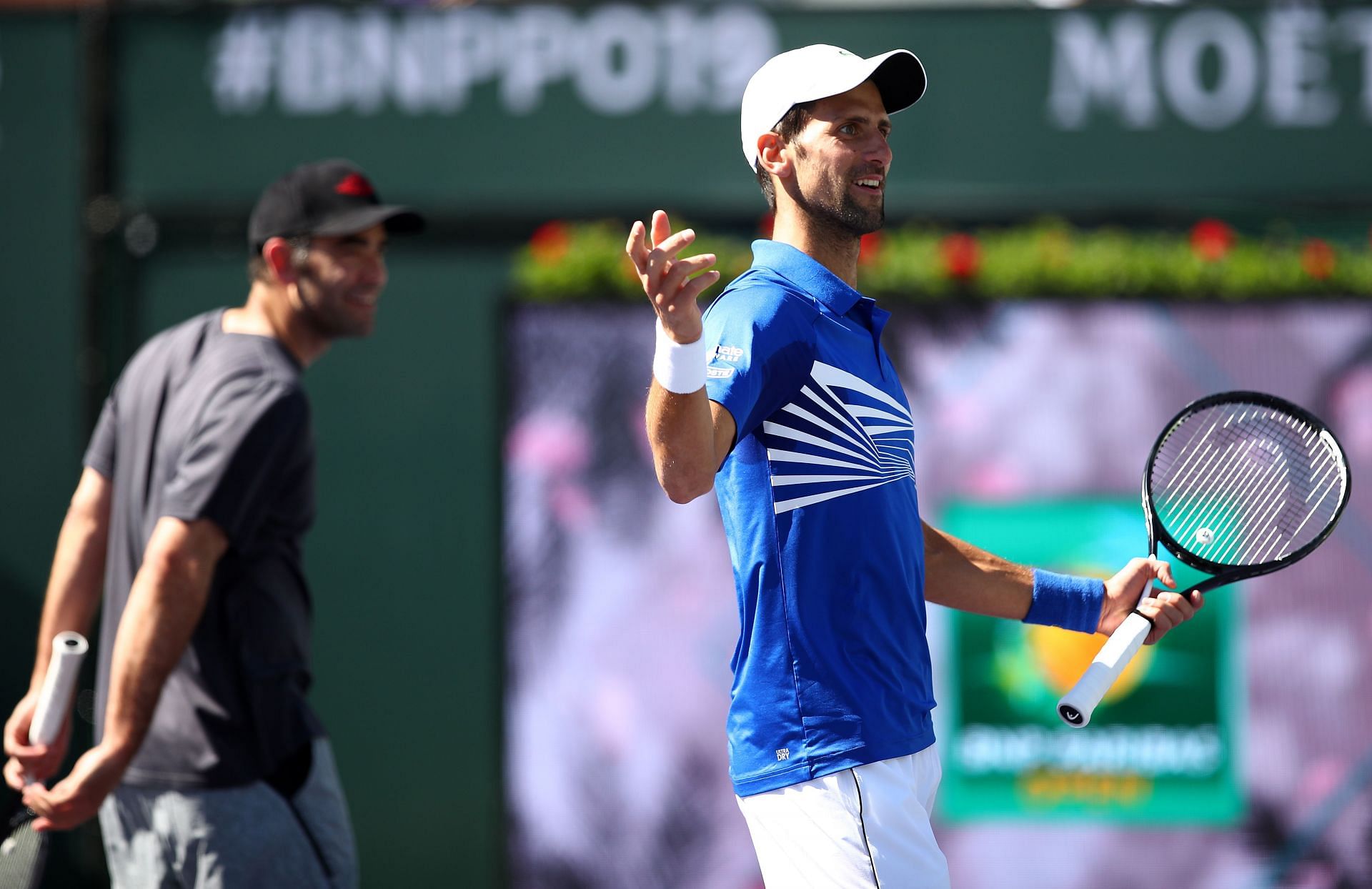 Pete Sampras and Novak Djokovic during an exhibition doubles match at Indian Wells in 2019