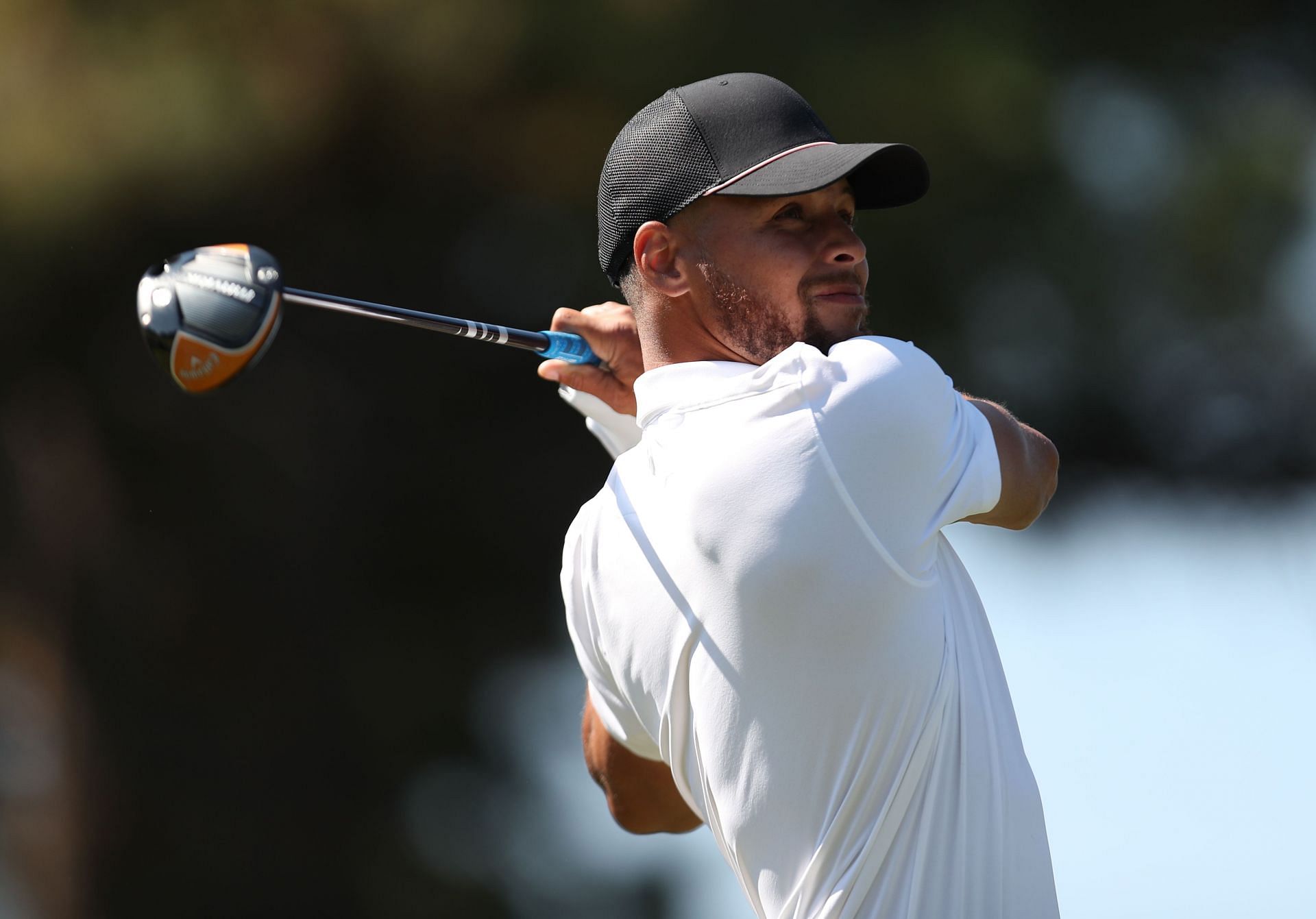 NBA star Steph Curry tees off on the third hole of the American Century Championship at Edgewood Tahoe South golf course