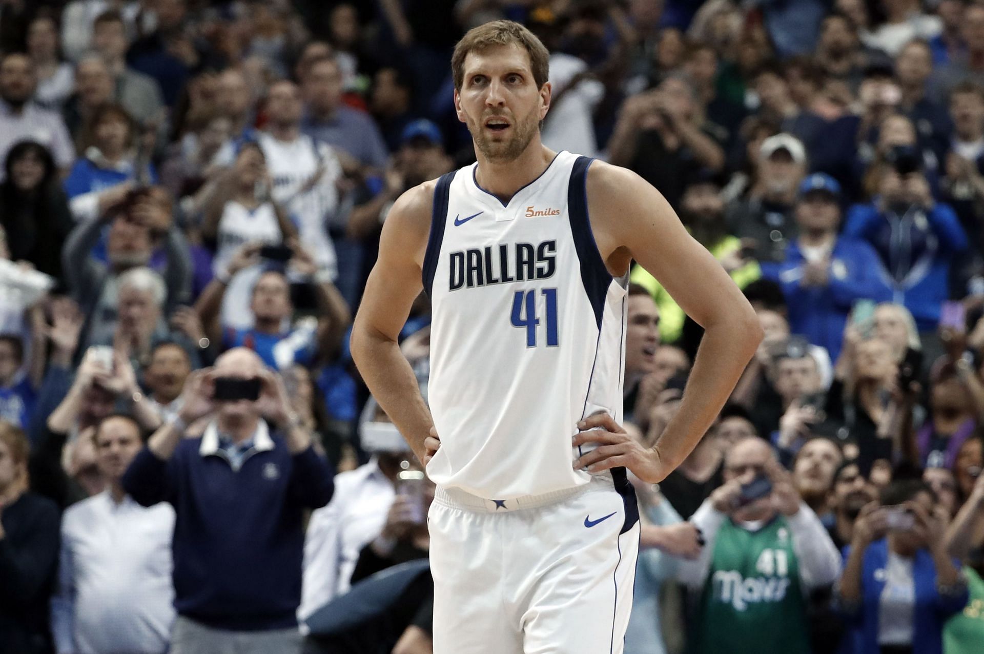 Dirk Nowitzki of Dallas Mavericks disagrees with Kareem Abdul