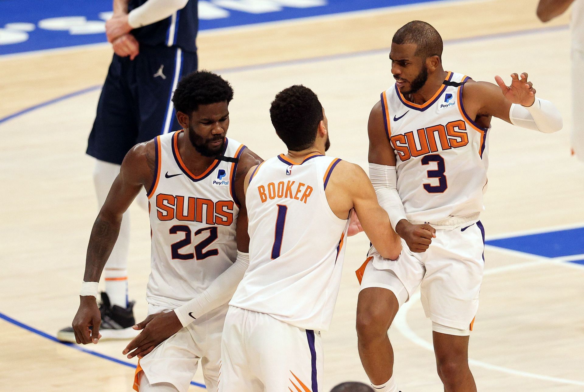 DeAndre Ayton, Devin Booker and Chris Paul of the Phoenix Suns