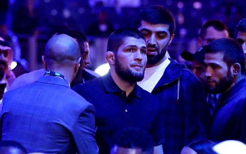 Retired mixed martial artist Khabib Nurmagomedov (center) at a boxing event