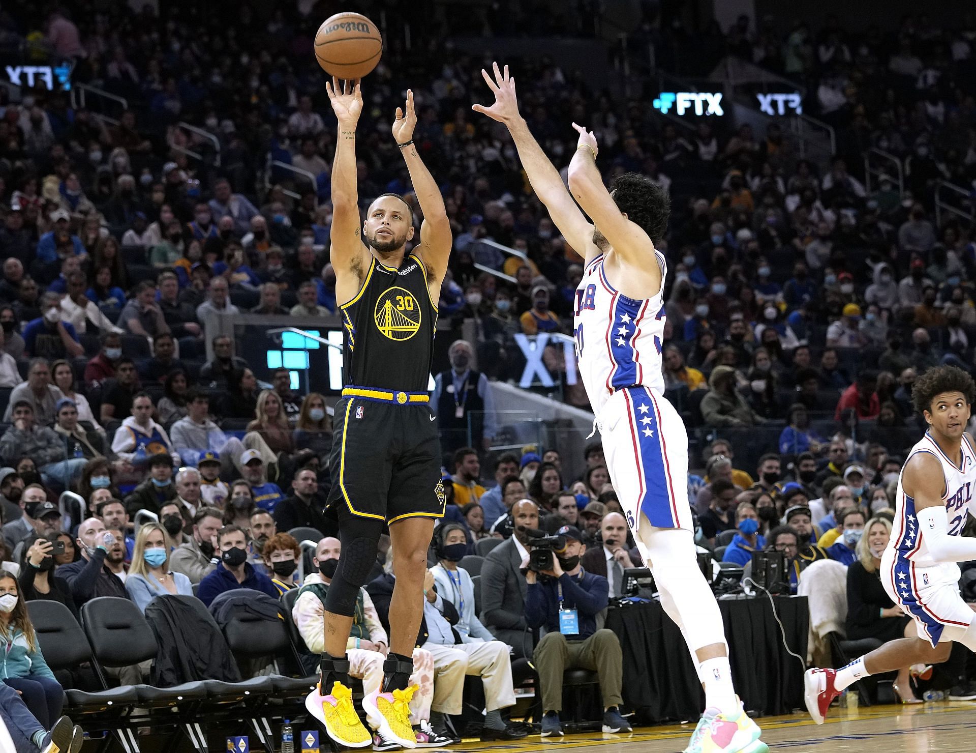 Stephen Curry of the Golden State Warriors shoots against Furkan Korkmaz of the Philadelphia 76ers