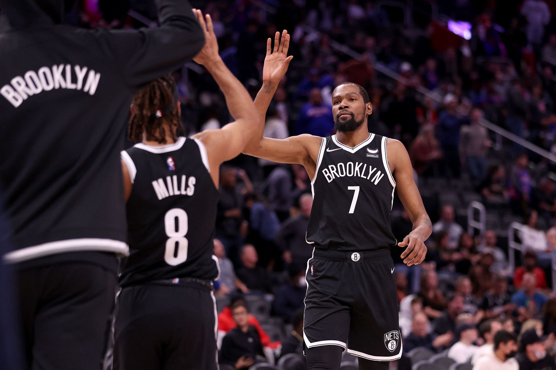 The Brooklyn Nets celebrate a play during a game against the Detroit Pistons.