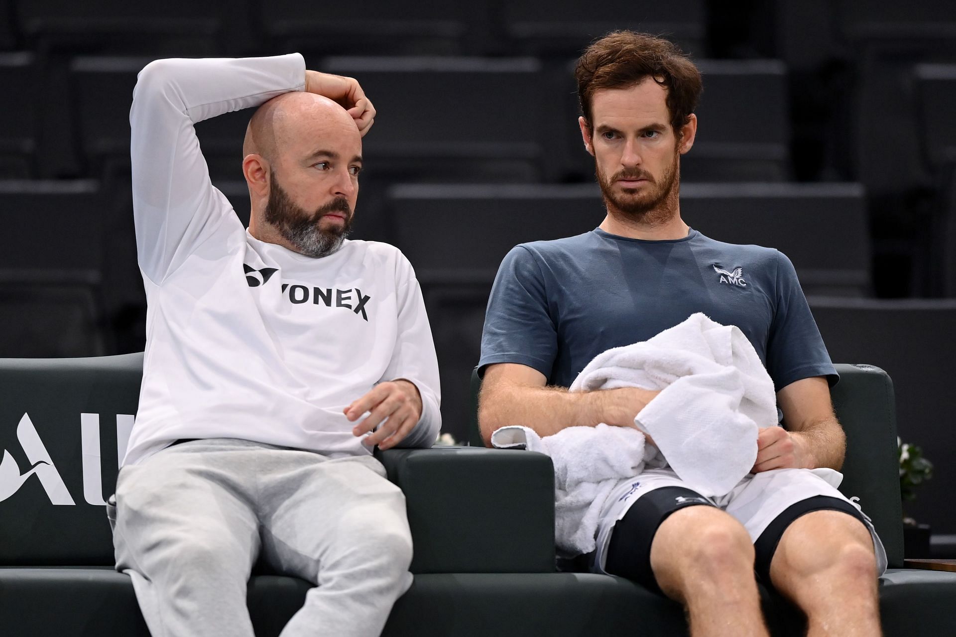 Andy Murray speaks with coach Jamie Delgado during practice at the 2021 Rolex Paris Masters