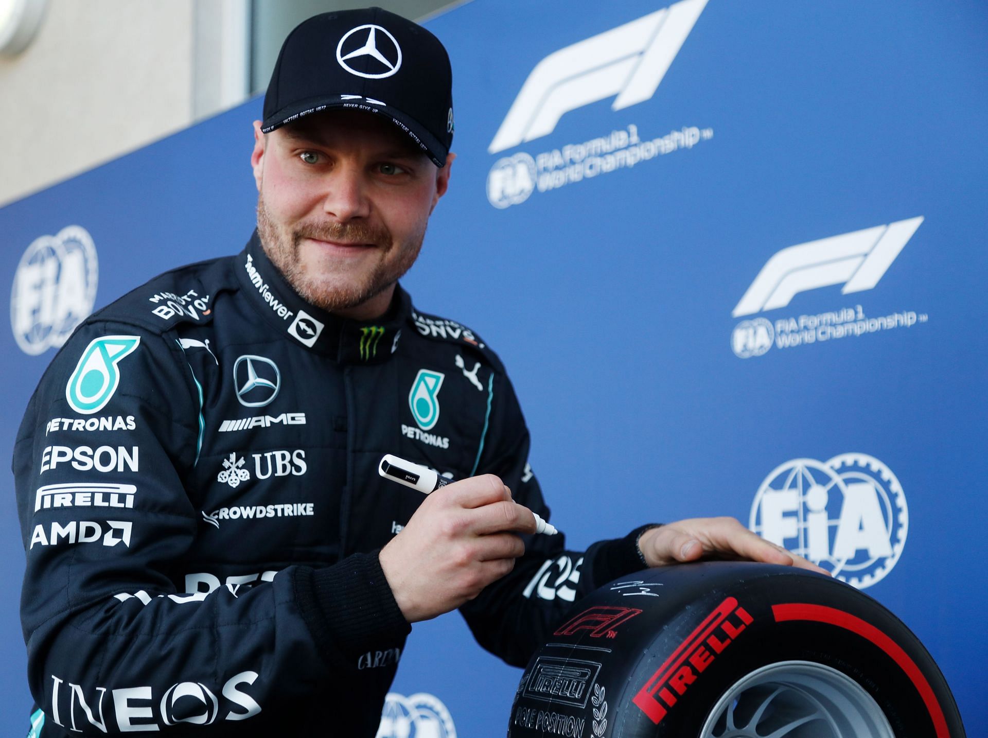 Pole position qualifier Valtteri Bottas of Finland celebrates in parc ferme post the qualifying session of the 2021 Mexican GP. (Photo by Francisco Guasco - Pool/Getty Images)