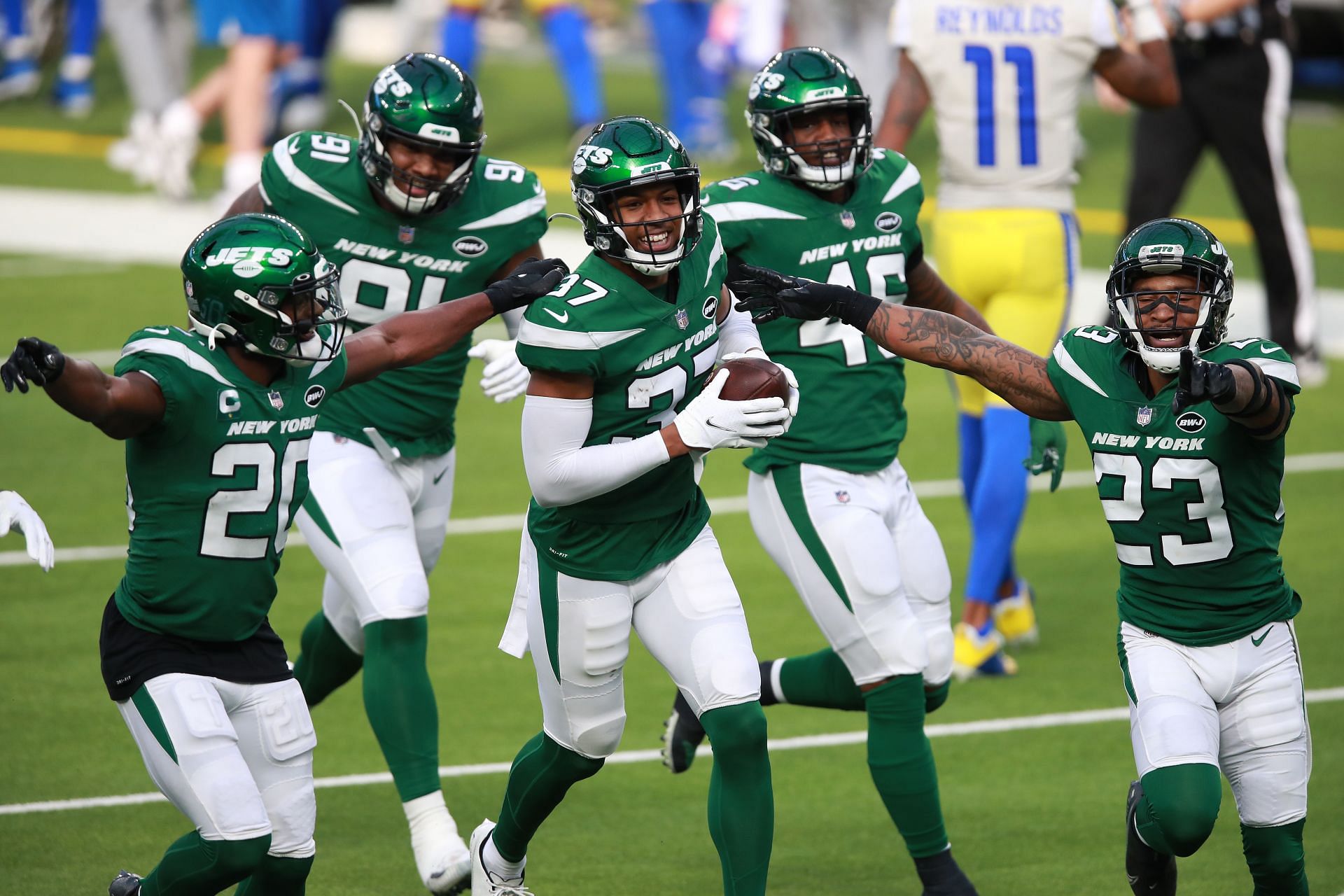 The Jets defense celebrates Bryce Hall&#039;s first NFL interception