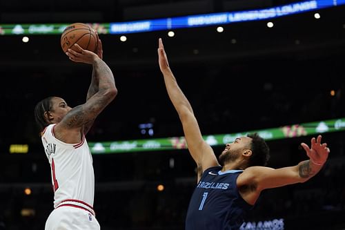 DeMar DeRozan (left) shoots over Kyle Anderson (right)