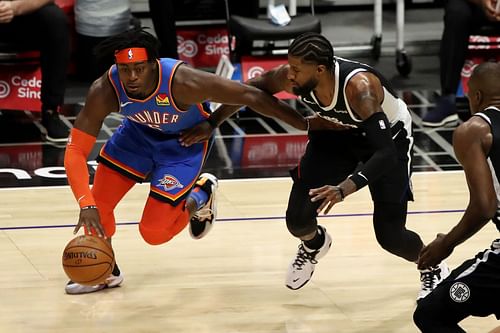 Luguentz Dort of the Oklahoma City Thunder against Paul George of the LA Clippers.