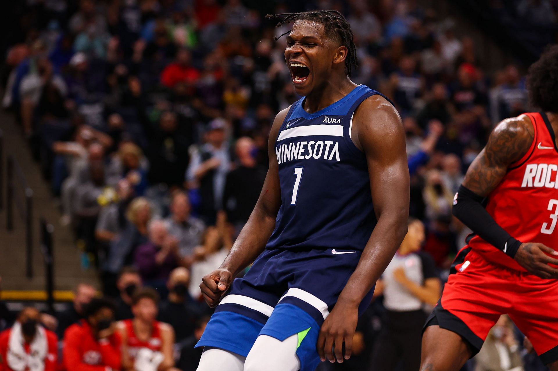 Anthony Edwards #1 of the Minnesota Timberwolves reacts after dunking the ball during the fourth quarter against the Houston Rockets at Target Center on October 20, 2021 in Minneapolis, Minnesota.