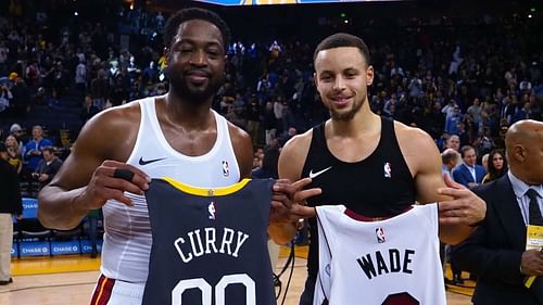 Miami Heat legend Dwyane Wade and Golden State Warriors' Stephen Curry exchange jerseys in 2019