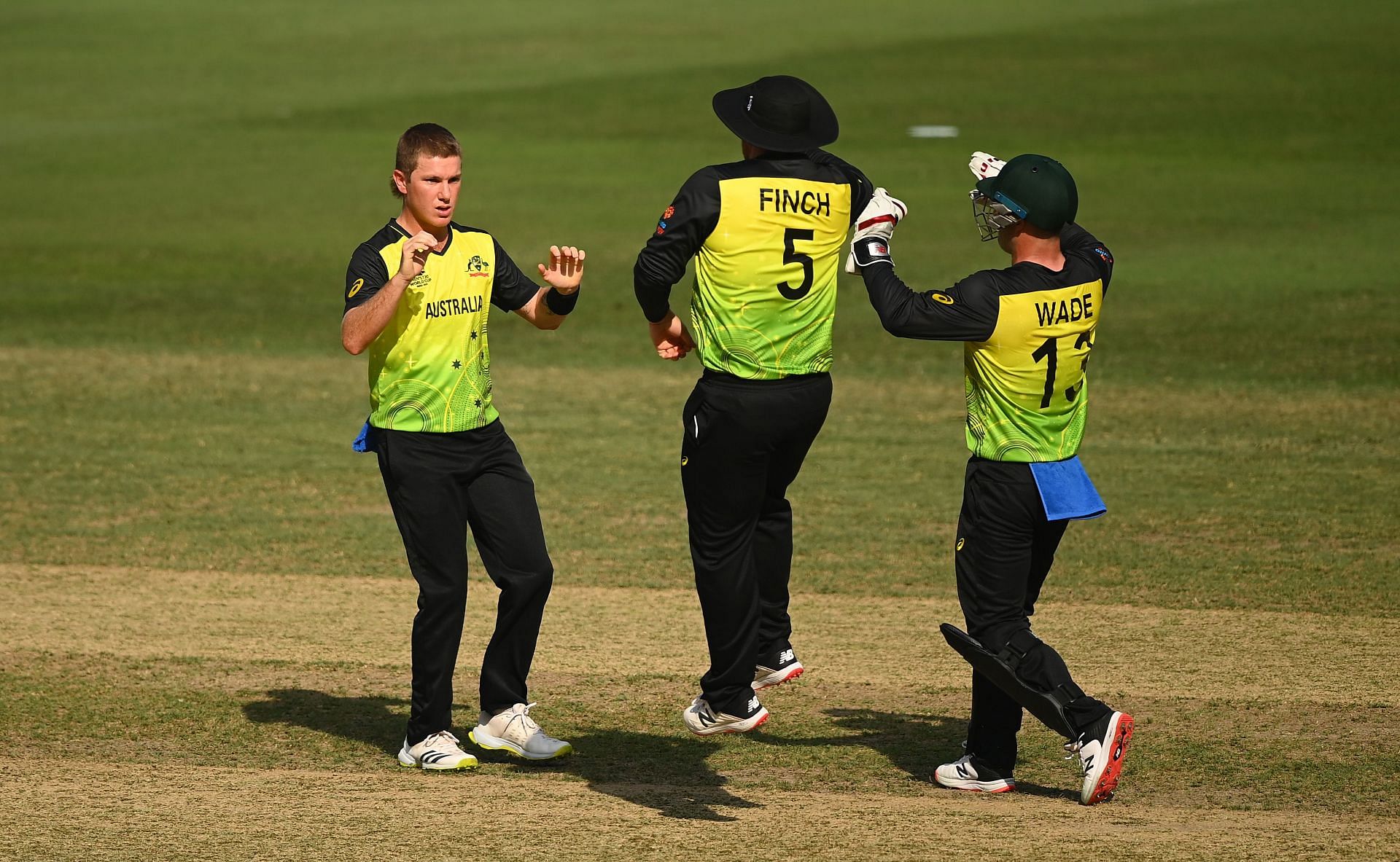 Adam Zampa (left) celebrates the wicket of Afif Hossain. Pic: Getty Images