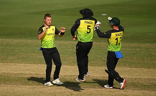 Adam Zampa (left) celebrates the wicket of Afif Hossain. Pic: Getty Images