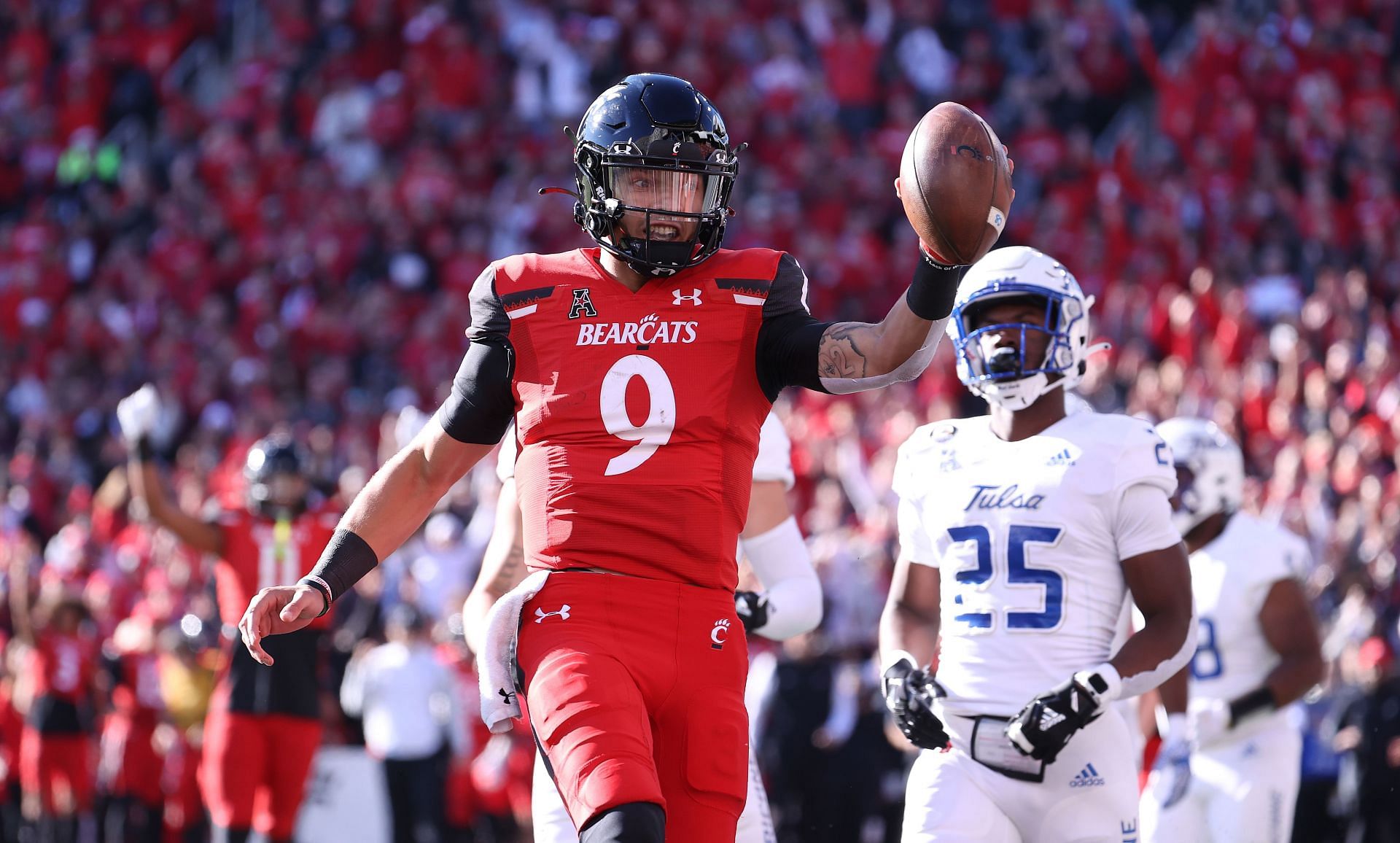 Ridder runs for a touchdown during a win over Tulsa earlier this fall. (Photo: Getty)