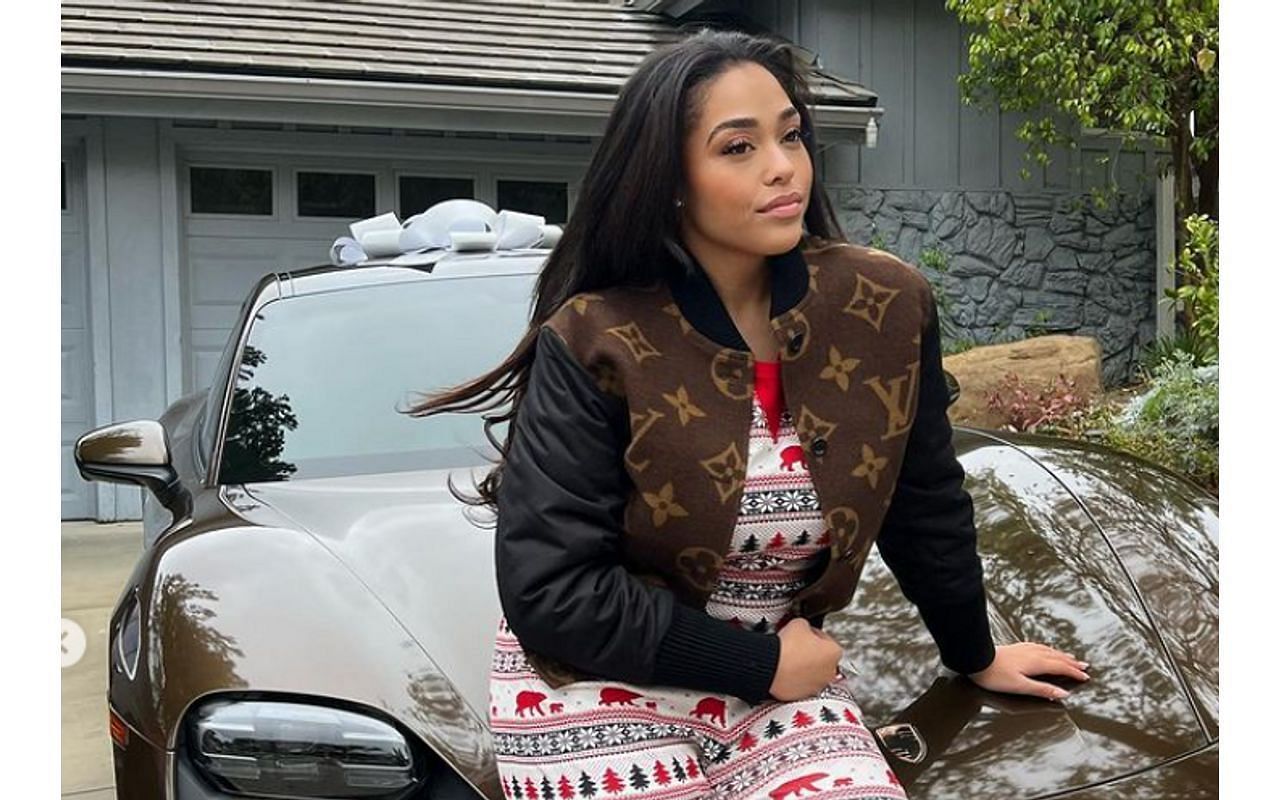 Jordyn Woods with the Porsche gifted by Karl-Anthony Towns (Image via Jordyn Woods/Instagram)