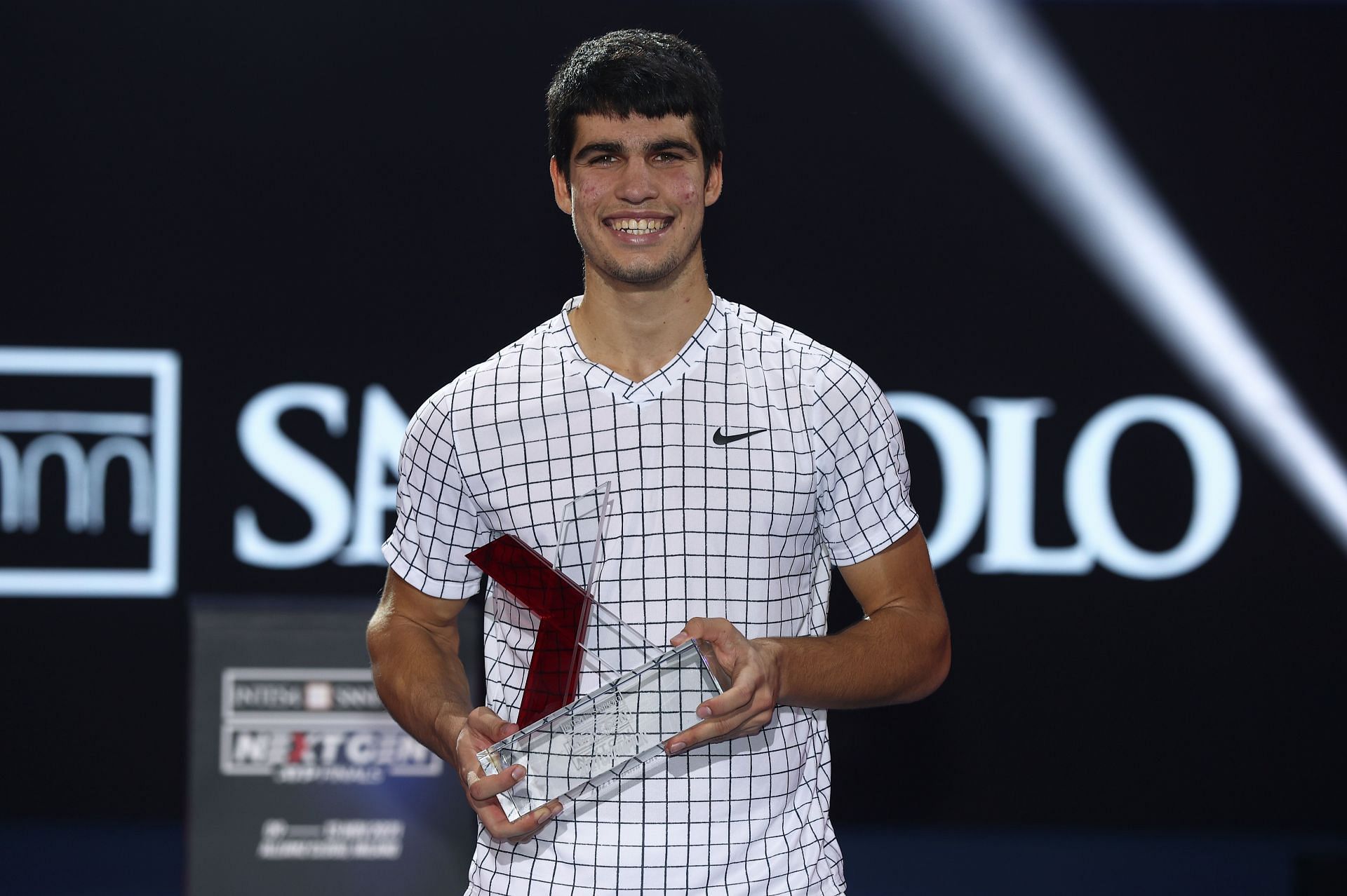 Carlos Alcaraz with the 2021 Next Gen ATP Finals trophy